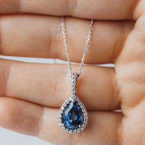 Pear Cut Tanzanite and Diamond Halo Pendant Necklace