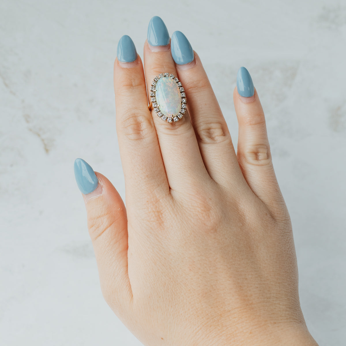 14K Yellow Gold Elongated Oval Opal & Diamond Halo Ring