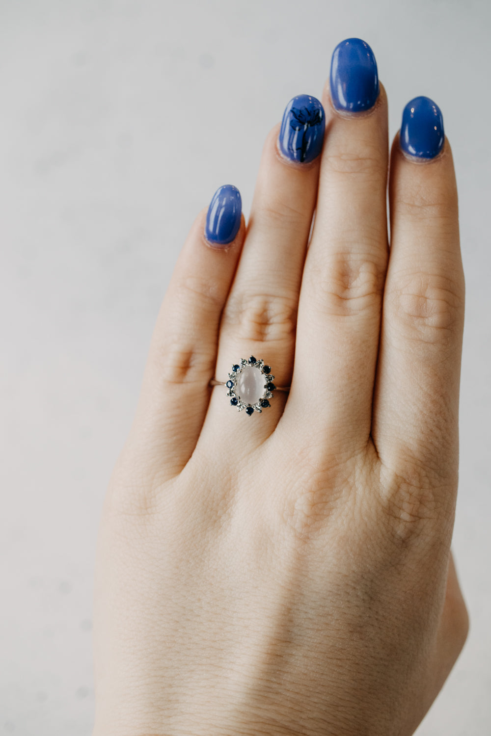 Cats Eye Moonstone and Diamond Blue Sapphire Halo Ring
