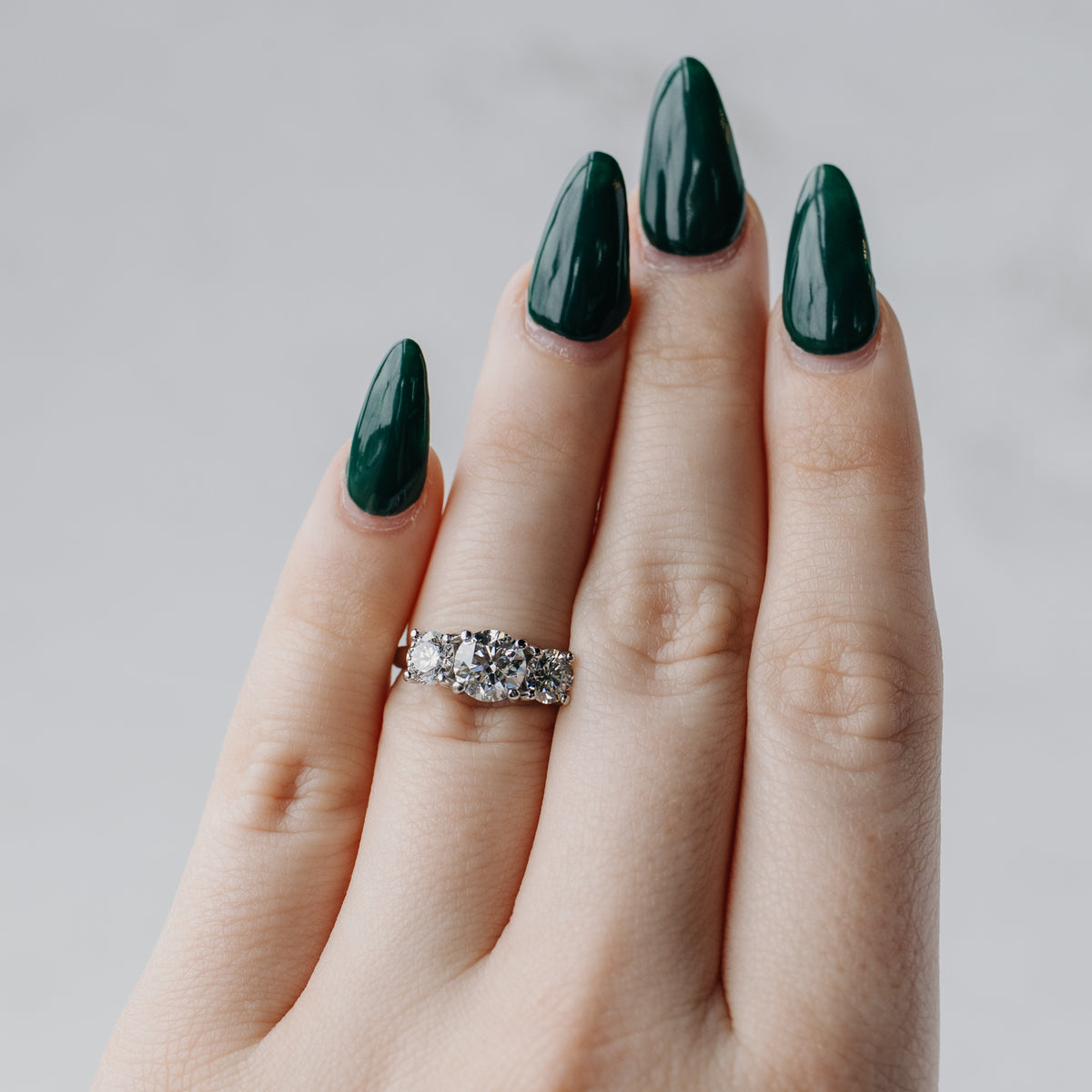 Three-Stone Round Brilliant Diamond & Platinum Engagement Ring