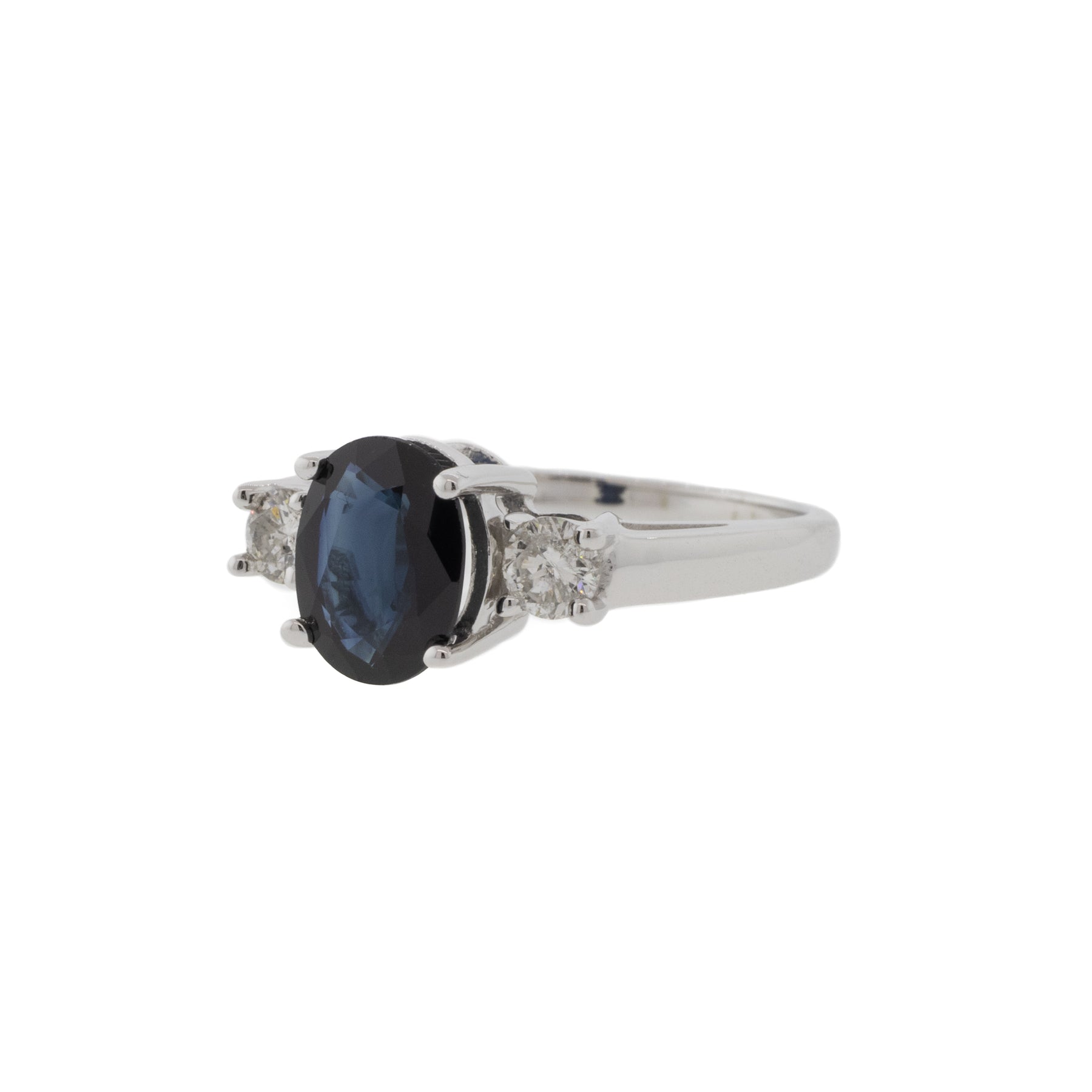 Dark Blue Sapphire and Diamond Three Stone Ring